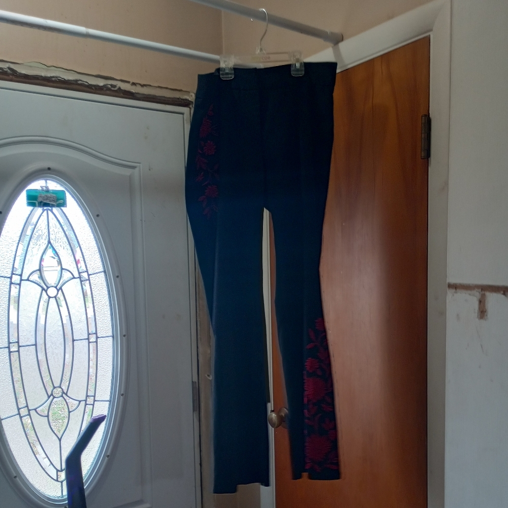 Black stretch pants with red flowers